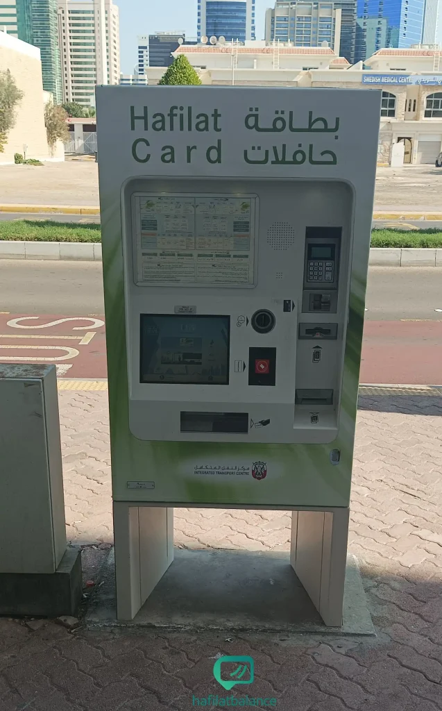 Hafilat ticket vending and balance inquiry machine at an Abu Dhabi bus station